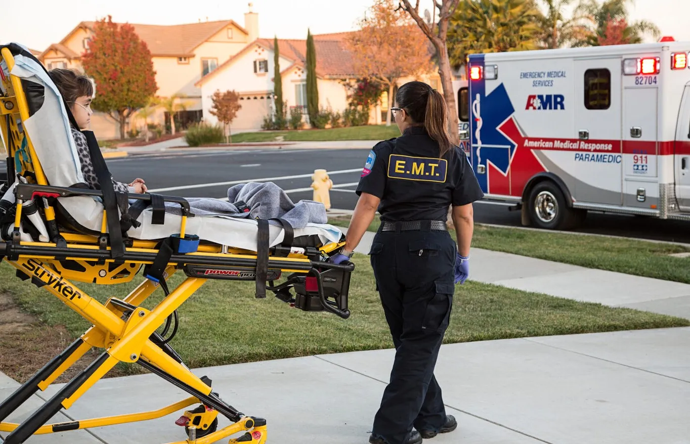 EMT taking a patient to the rig. 