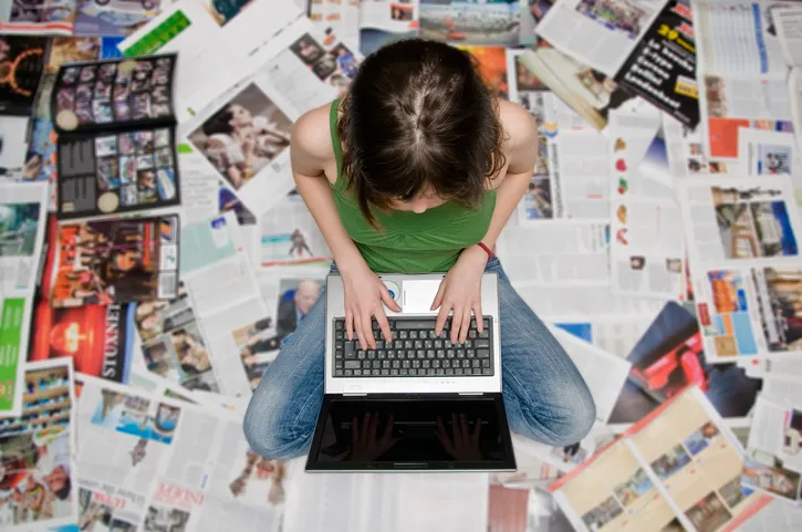image of a person at their laptop typing
